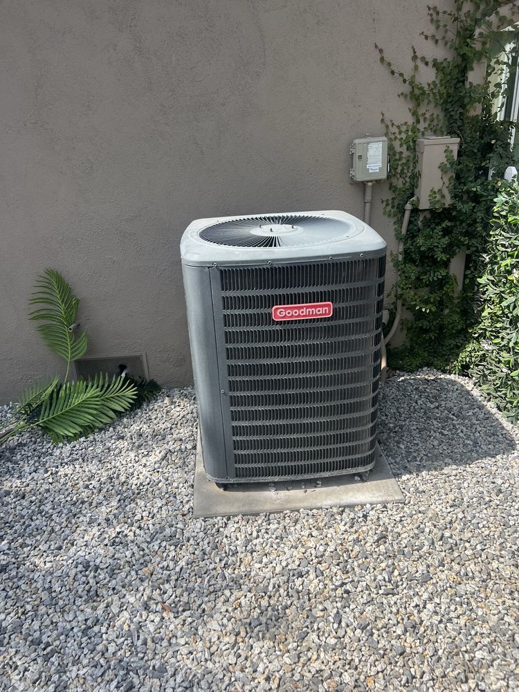 Goodman AC condenser installation on gravel pad